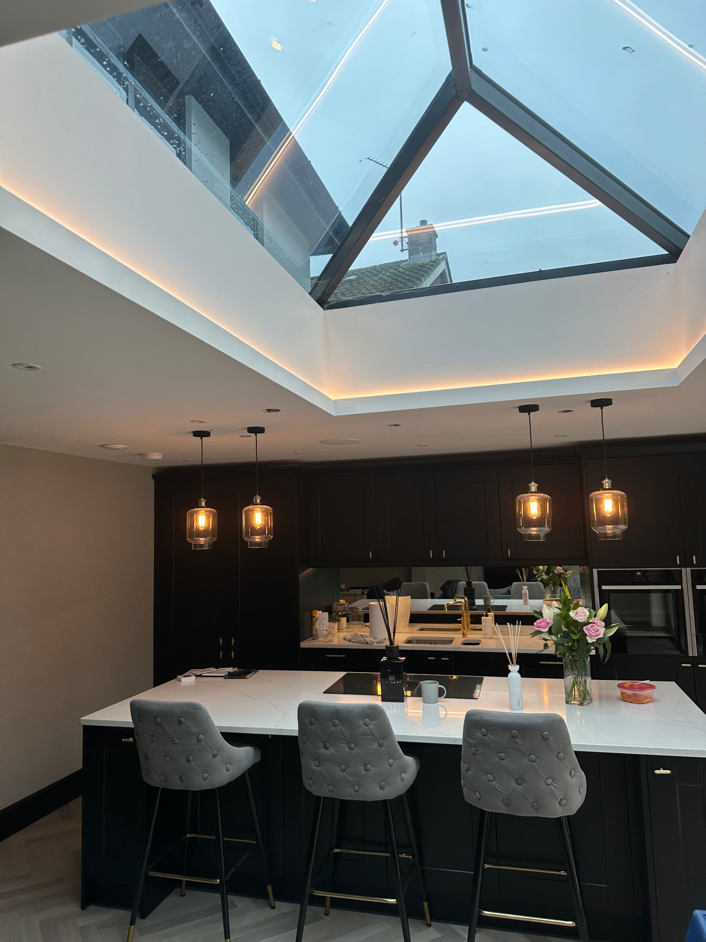 Kitchen extension with lantern roof, cove lighting and pendant lights